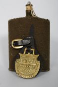 A vintage army military enamel drinking flask with original green Beize cloth covering, along with a