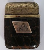 A crocodile skin covered match vesta with hallmarked silver cartouche to front and dating to 1922.