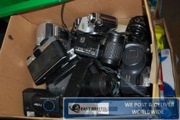 A box of vintage camera equipment to include Canon, Pentax etc