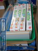 A box of childrens puzzles, along with ink cartridges etc.