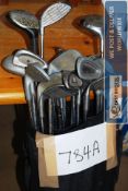 Vintage golf clubs in a bag to include Ping, Wilson etc.