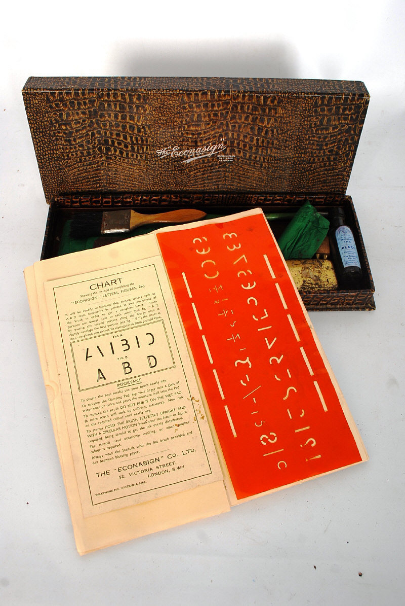 A boxed The Econasign printing set along with other printing related items.