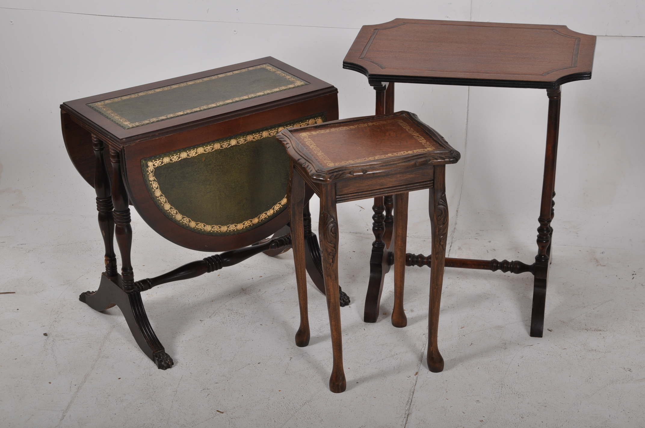 A pair of regency style reproduction mahogany side tables, together with another