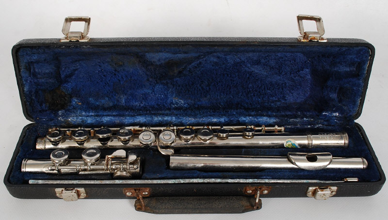 A Melody Maker flute complete with the original velvet lined carry case. 42 cms long