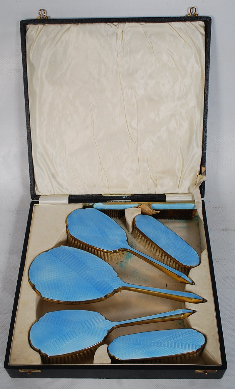 A 1930's Art Deco blue enamel ladies 4 piece dressing set complete in the original case. The