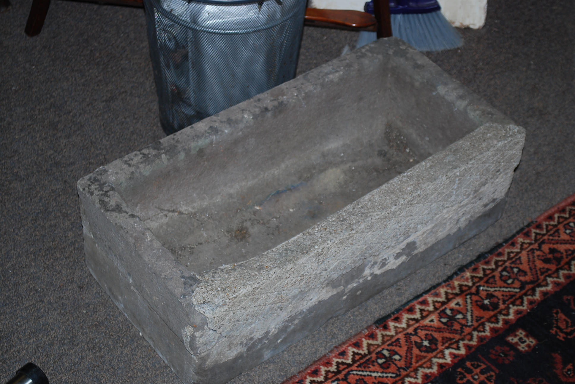 A 19th century stone trough of rectangular form (af) 20cms high x 61cms wide