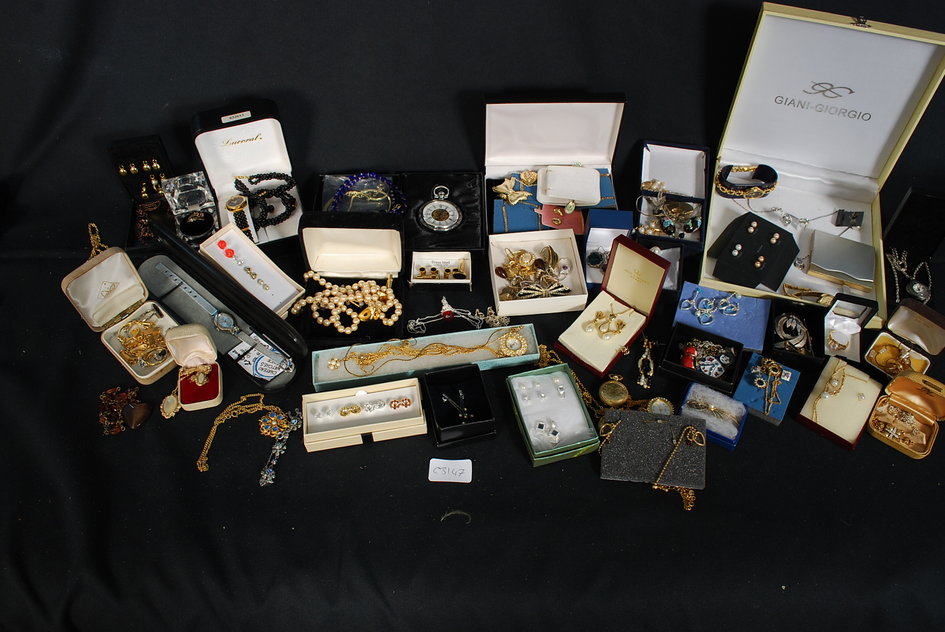 A mixed lot of costume jewellery to include many boxed watches.