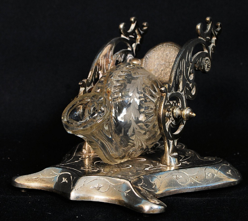 A decorative 20th century silver plate and glass inkwell in the form of a snail, The fret pierced