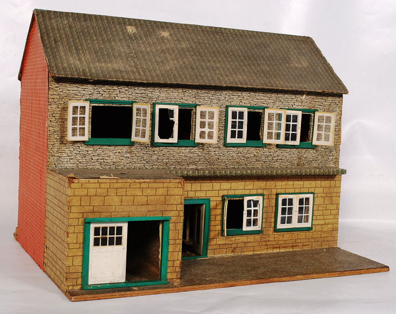 A 20th century childs two-tier dolls house.