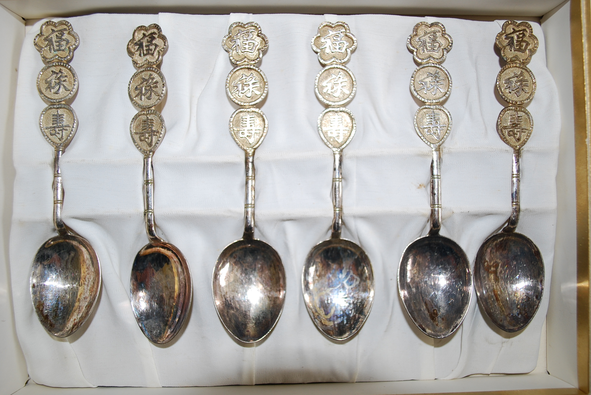 A set of six Chinese silver teaspoons stamped silver 90 with makers name  Lee Yee Hing of Hong