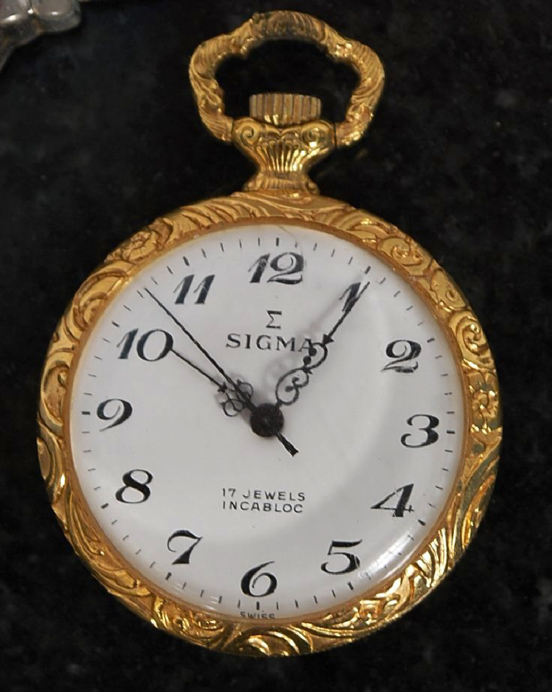 A decortive Sigma 17 jewel pocket watch, a Lorus nurses watch, a Reflex wristwatch