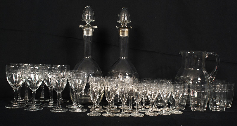 A very good quality crystal glass set comprising 2 decanters, tumblers, wine glasses, sherry glasses