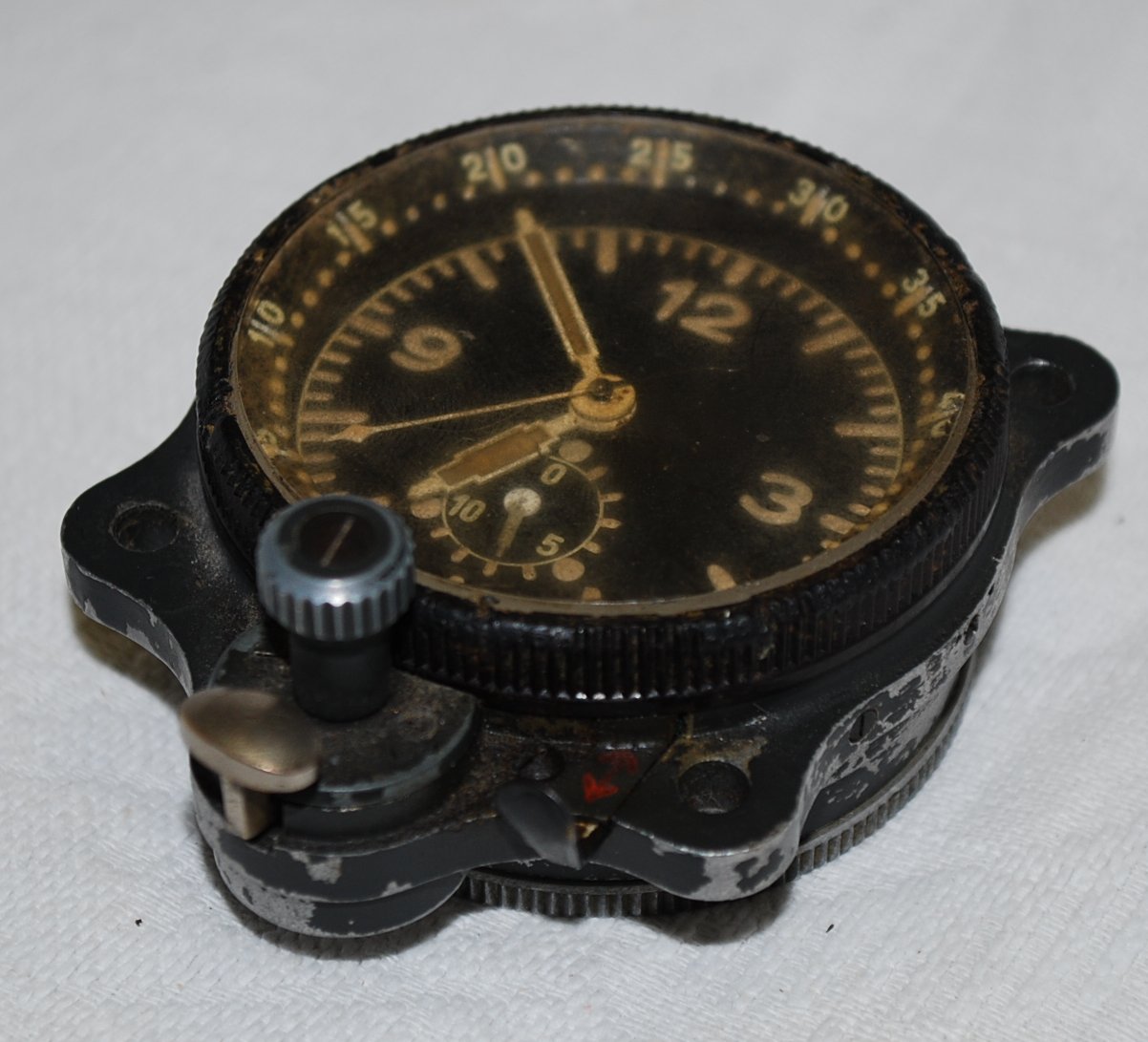 A German WWII Luftwaffe navigators clock with stop watch and time elapsed facilities. Alloy case