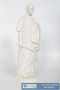 A white glazed figure of a Roman Senator. 26cm tall.