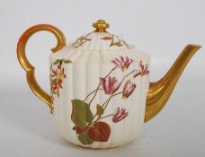 A 19th Century Royal Worcester blush porcelain teapot. Of circular ribbed form decorated with