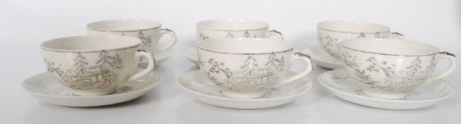 A set of six translucent Japanese cups and saucers.