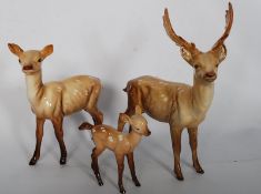 A good group of Beswick deers to include the stag, doe and fawn. All signed to base and in good
