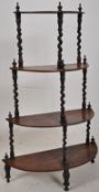 A 19th century Victorian rosewood whatnot etarge. The demi lune shelves united by barley twist