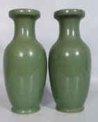 A pair of Chinese Celadon crackle glaze green baluster vases. The vases having bottle shaped bodies