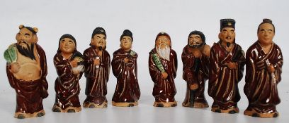 A collection of unusual 20th century Chinese figurines, To include scholars of varying size, the