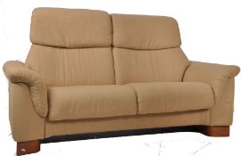 An Ekornes Stressless reclining 2 seat sofa settee. Upholstered in a natural fibre fabric, standing