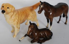 A beswick figure of a bay horse, a Beswick seated foal and a Beswick labrador dog.
