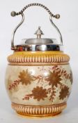 A Victorian silver plate biscuit barrel with foliate china decoration to base, along with