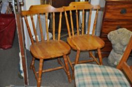 A contemporary pine kitchen dining table on turned legs. Dismantles for ease of transport and