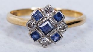 An 18ct yellow gold ring with blue and white stones stamped 18ct.