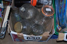 A box of glass wares to include Killner jars, beer bottles etc