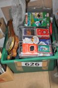 A quantity of unused T-shirts, deodorants, playing cards, brass handles etc