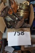 A mixed lot of brass and iron wares to include scarab beetle boot jack, brass cauldron and other