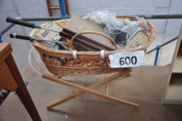 A complete moses basket, with military books, cutleryset, ornaments etc.