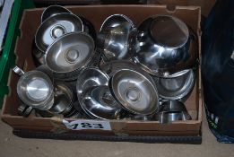 A box of vintage stainless steel plates, jugs etc.
