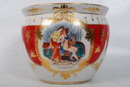 A decorative red and white Limoges style planter / plant pot having red and white striping and