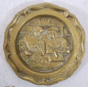 A 19th century heavy brass wall plaque / charger of continental flemish origin. The relief centre