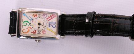 A ladies `Colour Dreams` watch with dial stamped `Franck Muller,` with large cartoon-like numerals.