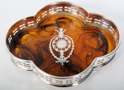 A faux tortoiseshell inlaid tea caddy, standing on turned bun feet with inlaid mother of pearl