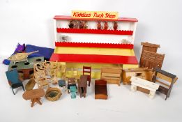A childrens shop and a quantity of vintage dolls house furniture