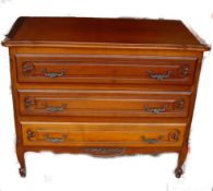 A french 20th century fruitwood commode chest of drawers in the louis 15th style. Shaped legs with