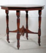 A Victorian solid mahogany octagonal centre table. Turned supports united by lower tier with table