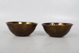 A pair of brass handworked finger bowls. 4.5cms tall x 12.5cms diameter