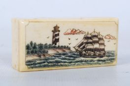 A small bone box with nautical shipping scene decoration.