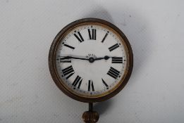 An early 20th century Brevet Swiss 8 day enamel faced dashboard / travel clock watch having swiss
