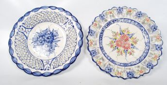 Two large decorative 20th century china plates with pierced rim design. 40cm across
