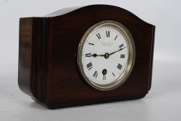 An early 20th century solid mahogany 8 day mantle clock signed Marcks & Co Bombay & Poona. The