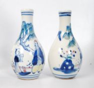 A pair of Chinese porcelain hand painted vases of scholars marked to base. 12cm tall.
