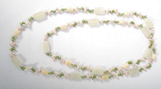 A baroque multi-coloured pearl and rose quartz necklace.