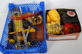 A collection of early 20th century assorted vintage meccano. Various parts including wheels,