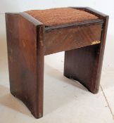 A 1930`s Art Deco walnut piano stool having good angular supports either side of a hinged